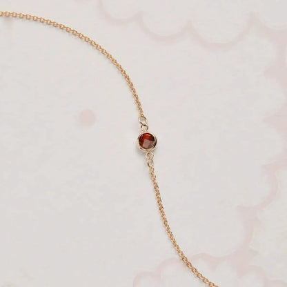 Petite 1 Garnet Bracelet in 14k Gold (January)