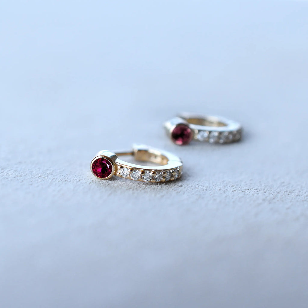 Tiny Ruby Huggie Hoops with Diamonds in 14k Gold (July)