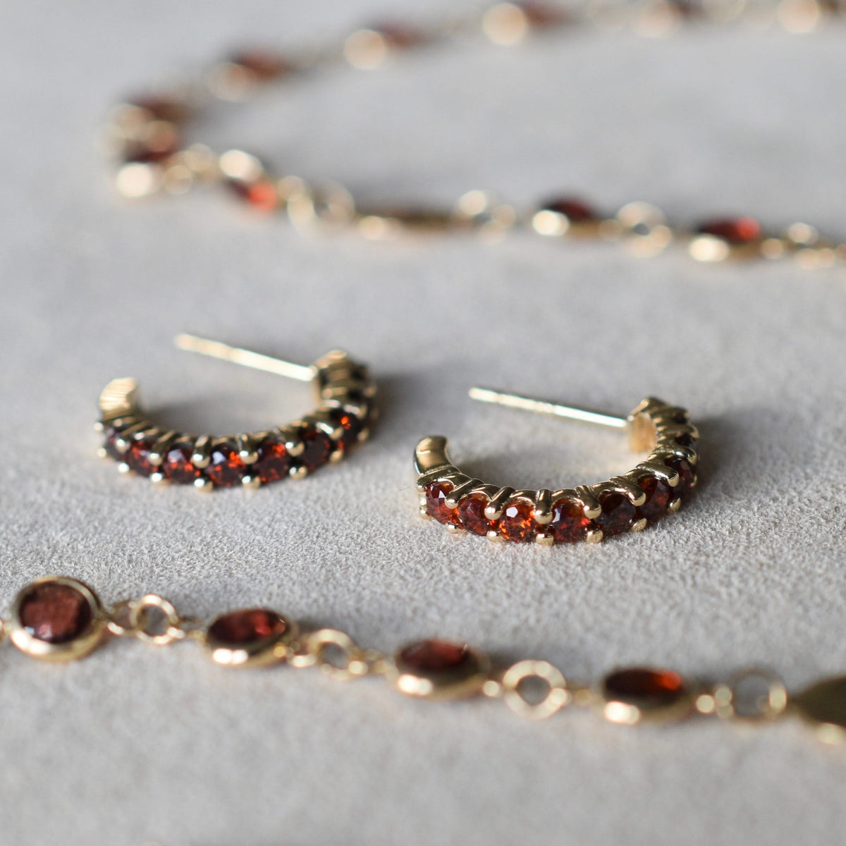 Rosecliff Garnet Huggie Hoop Earrings in 14k Gold (January)